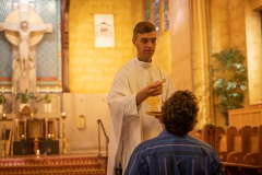 Father-Randall-distributes-the-Eucharist