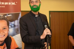 Father Randall dyed his beard green in honor of men's soccer volunteers